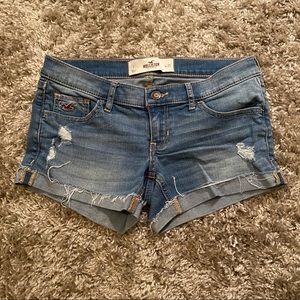 ripped medium wash jean shorts